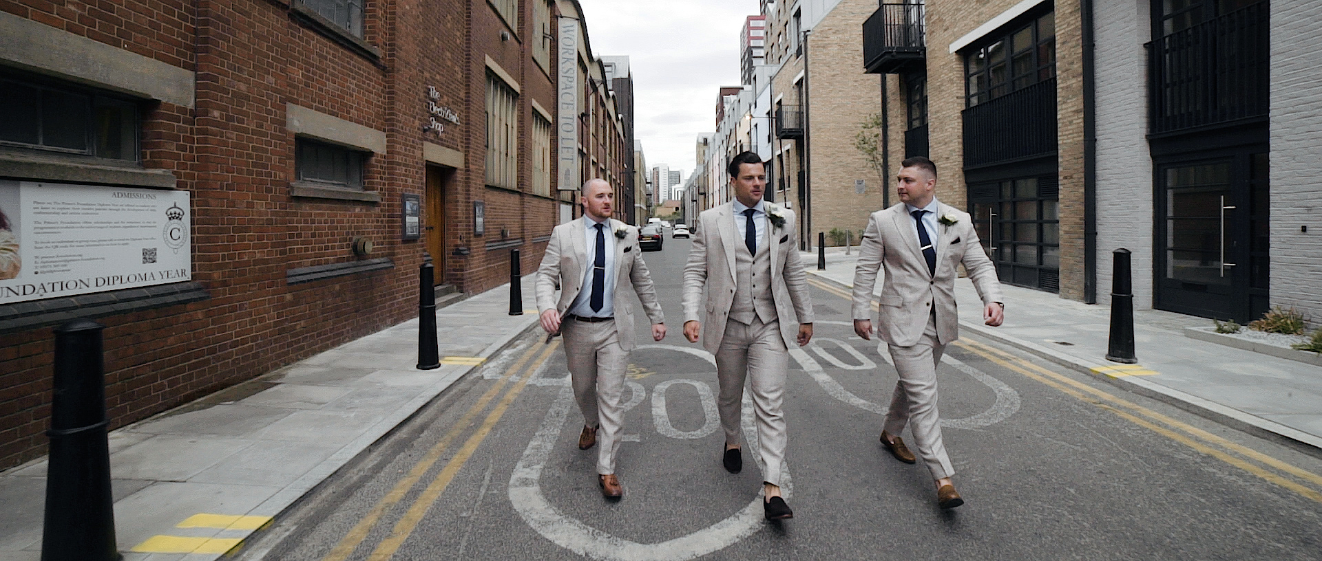 Groom walking to Trinity Buoy Wharf 