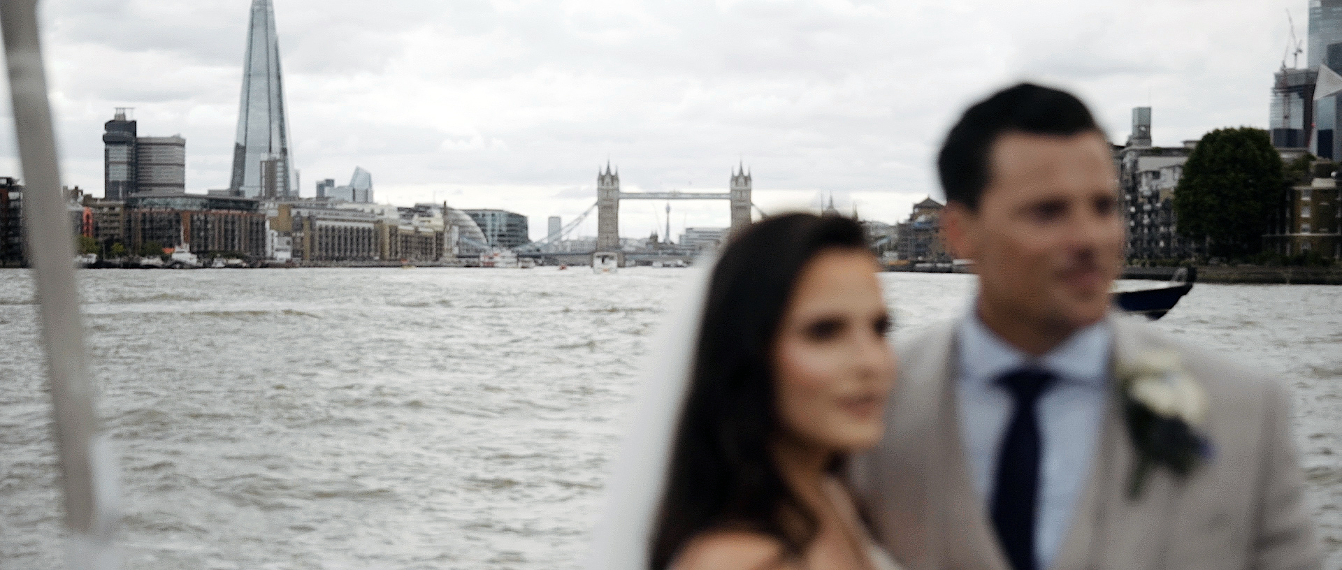 Wedding couple on a boat on the thames in london